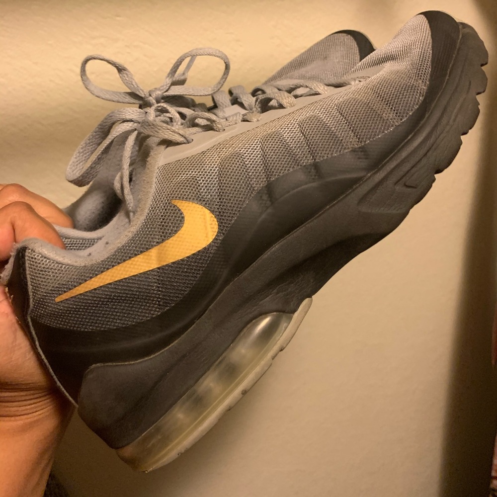 Woman’s Nike running shoes Black, Gold & Grey